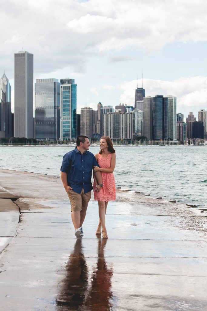 Chicago, Illinois Engagement session on Lake Michigan with a background of the city skyscrapers photography by Sara Anne Johnson