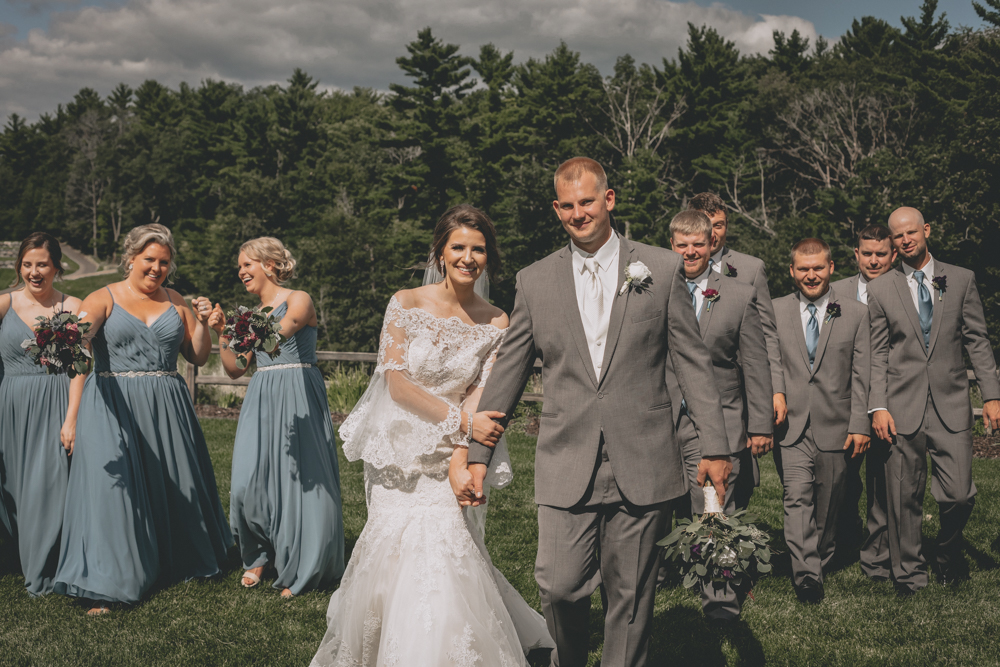 Wisconsin Dells Summer wedding with deep burgundy flowers and dusty blue bridesmaid dresses at Glacier Canyon by Sara Anne Johnson. Sara Johnson Photography
