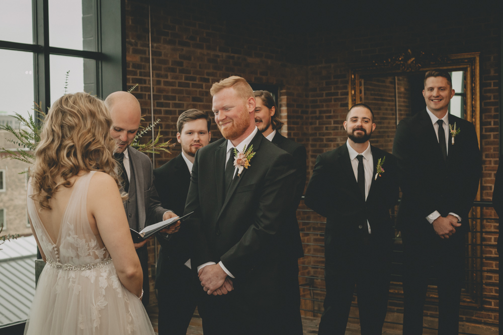 Rainy, urban, rooftop October wedding in downtown Rockford, IL at The Standard with London Avenue, blue suede wedding heels, and a wild flower bouquet - Sara Anne Johnson - Photographer