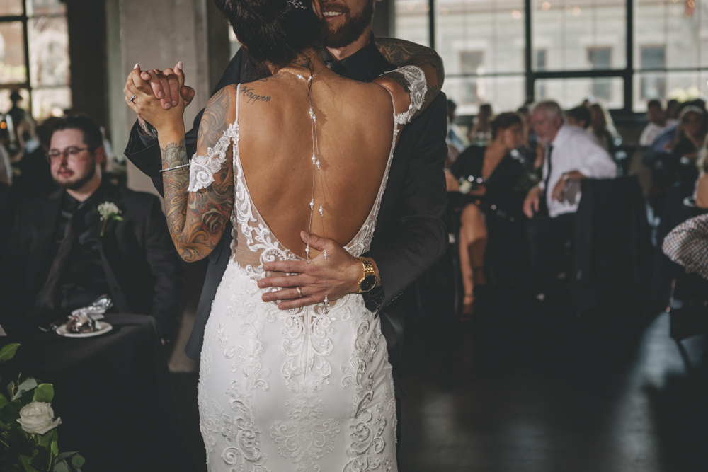 Chic, urban, rooftop summer wedding in downtown Rockford, IL at The Standard with London Avenue, Arch Apothecary, and gold, black, and green accents - Sara Anne Johnson - Photographer