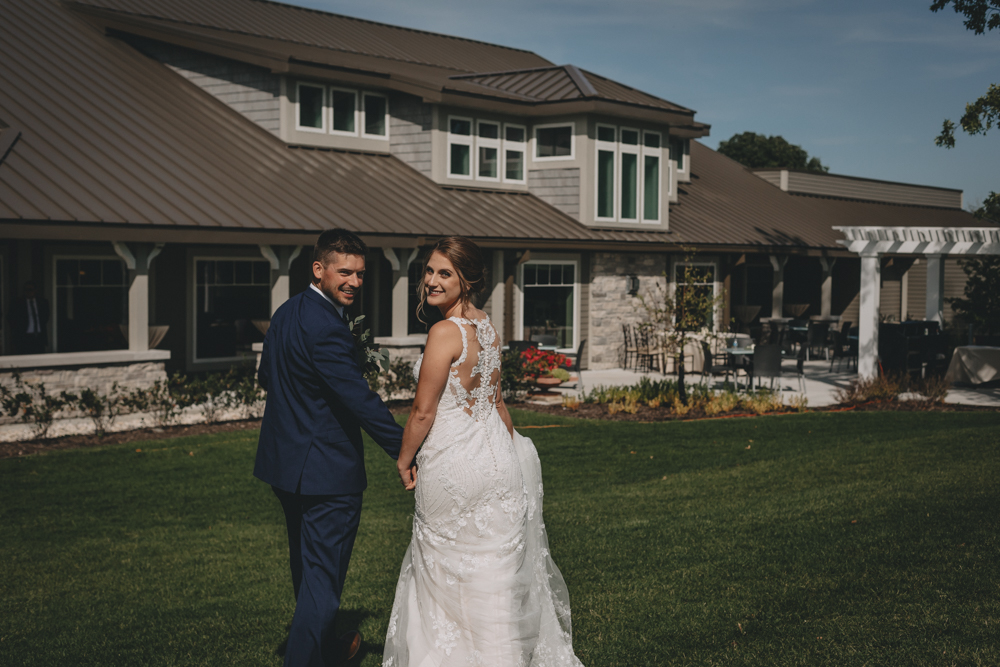 Romantic champagne blush and navy September wedding at Rockford Bank and Trust Pavilion in Rockford Il photographed by Sara Anne Johnson